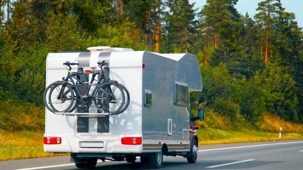 Camper van on the road carrying bikes