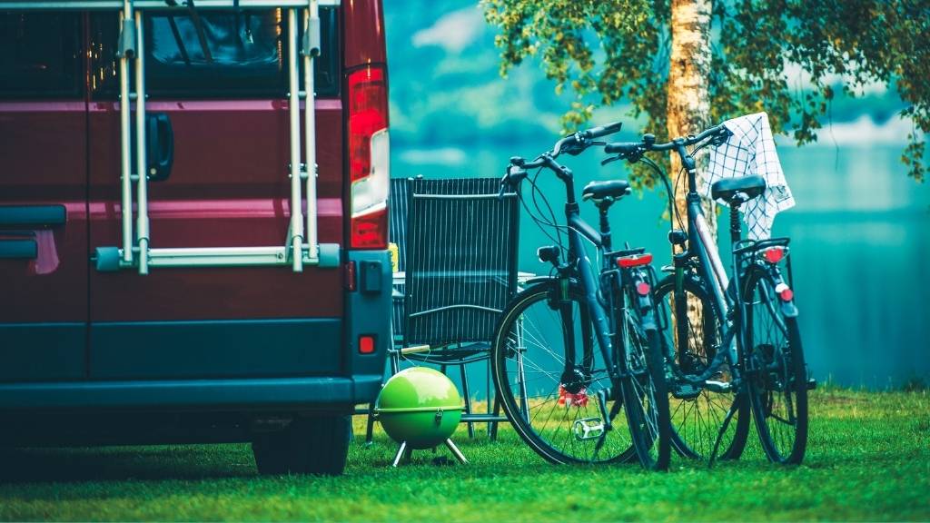 Campervan security: van set up on campsite with bikes